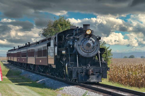 istock View of an Antique Passenger Train Approaching with Restored Coaches 1351666172