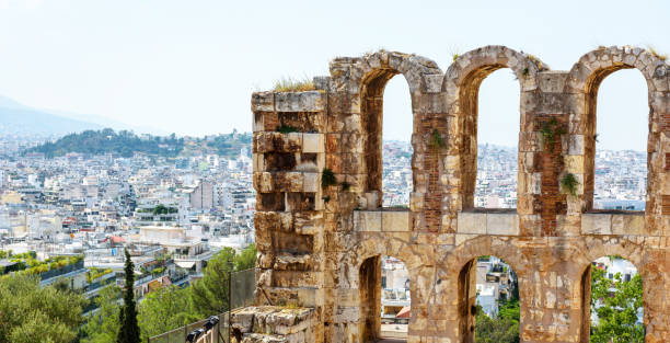 Athens panoramic view from Odeon of Herodes Atticus at Acropolis, Greece, Europe. This ancient Greek theater is famous landmark of Athens. Old ruins, classical monument in Athens city center.