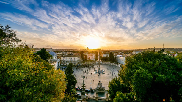 An idyllic sunset illuminates the historic heart of Rome seen from the terrace of the Pincio Gardens stock photo