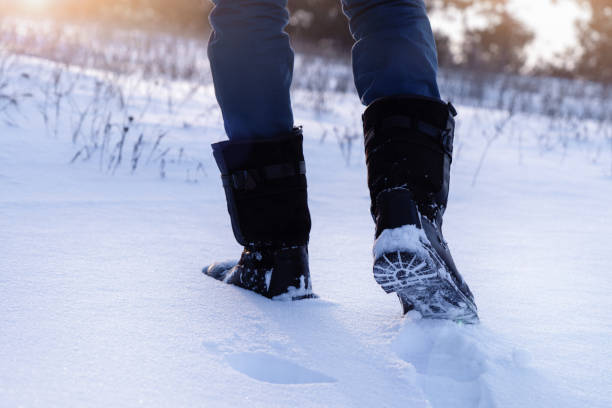 istock A man walking on a snowy road. 1351667762