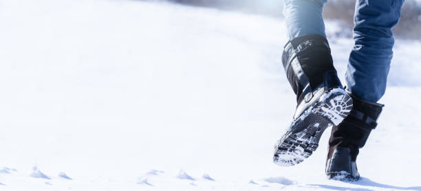 istock A man walking on a snowy road. 1351668285