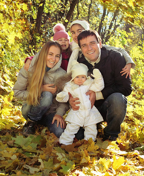 istock Young happy family in autumn forest 135166921