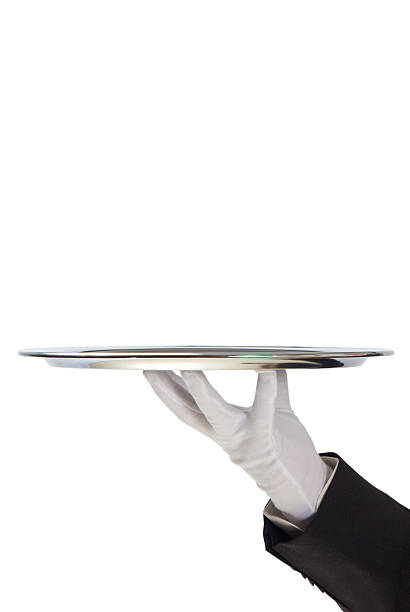 istock Butler holding empty silver tray in gloved hand 135167431
