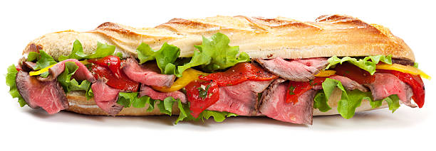 длинная сэндвич багет - sandwich delicatessen roast beef beef стоковые фото и изображения
