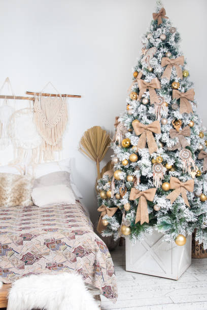 istock Christmas tree near the bed 1351678783