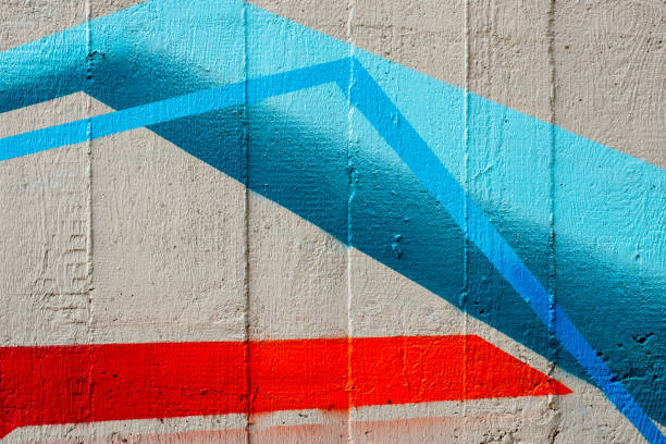 A concrete wall with vivid colored lines
