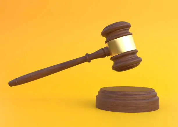 Wood Judge gavel on yellow background. Payment for legal education. Bidding at auctions. Liability for corruption. Protection of rights. Law and fine. Tax avoidance. 3d render illustration