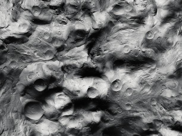 istock Surface of the moon with impact craters and mountains 1351681395