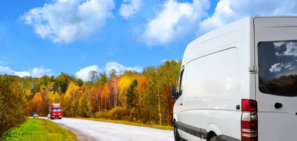 istock White van moving on the road in countryside. 1351681403