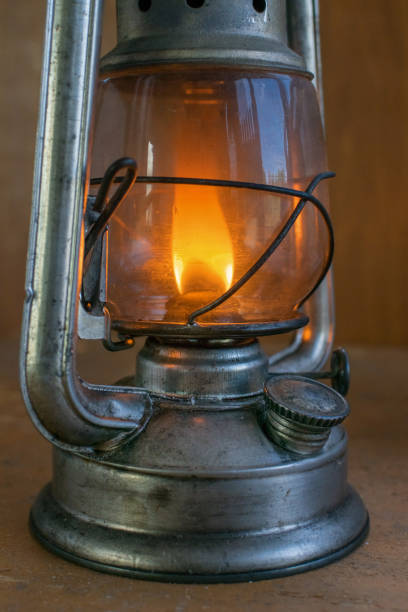 istock Vintage kerosene lamp with fire inside and glass bulb 1351681438