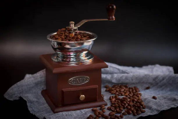Vintage handmade wooden coffee grinder. Coffee Mill
