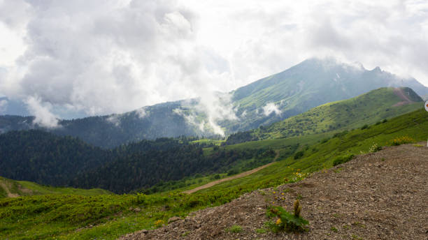 istock Mountain valley shrouded in clouds 1351681657