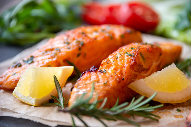istock Cooked salmon fish fillet with lemon and rosemary 1351682904