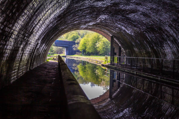 An optical illusion with water in a canal tunnel stock photo