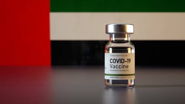 Covid Vaccine Bottle with the UAE Flag in the Background Corona Vaccine Ampule in front of a Emirati Flag Covid Vaccine Bottle with the UAE Flag in the Background Corona Vaccine Ampule in front of a Emirati Flag crista ampullaris photos stock pictures, royalty-free photos & images