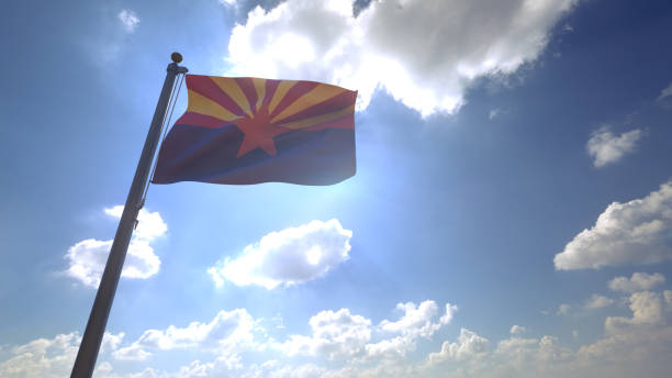 Arizona State Flag on a Pole with Blue Sky and Clouds in the Background