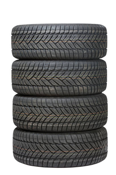 Four black tires stacked on top of one another stock photo