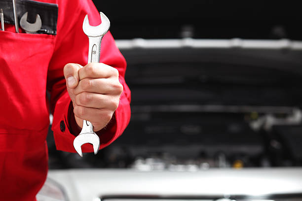 istock A man holding a two sided wrench about to use it 135168888