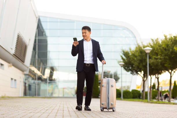 istock Businessman corresponded in a mobile phone uses the messenger application to communicate with colleagues at a distance 1351692822