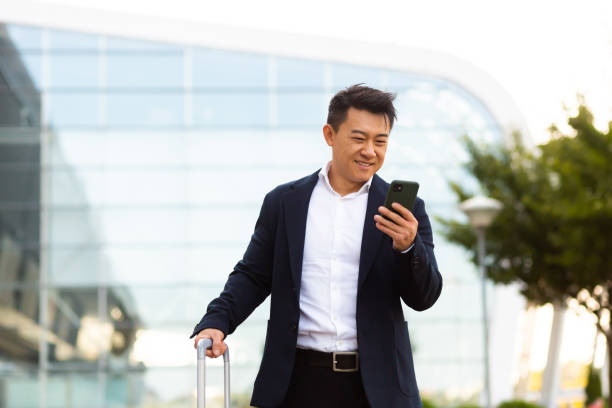 istock Businessman corresponded in a mobile phone uses the messenger application to communicate with colleagues at a distance 1351692823