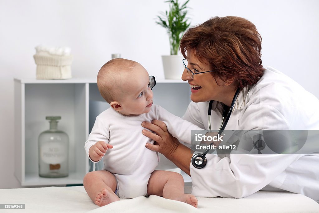 Doctor with baby patient Doctor with baby patient.  Baby - Human Age Stock Photo