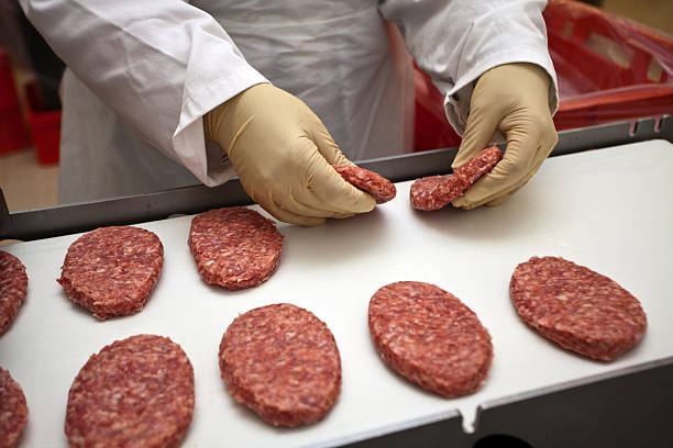 Cooked burgers over iron grill