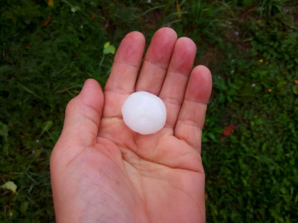 a large hailstone in your hand after a summer hurricane - fazendo sinal com a mão imagens e fotografias de stock