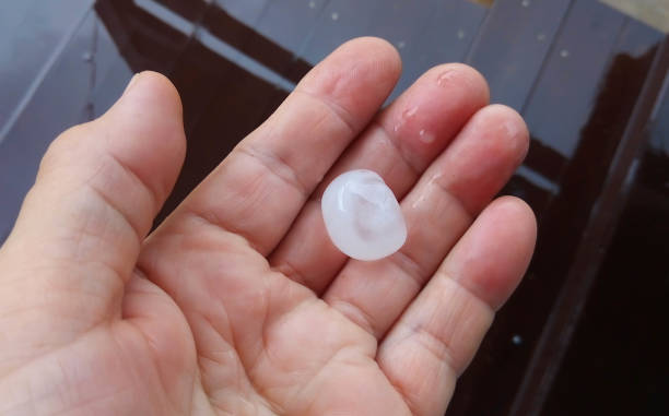 istock A large hailstone in your hand after a summer hurricane 1351703017