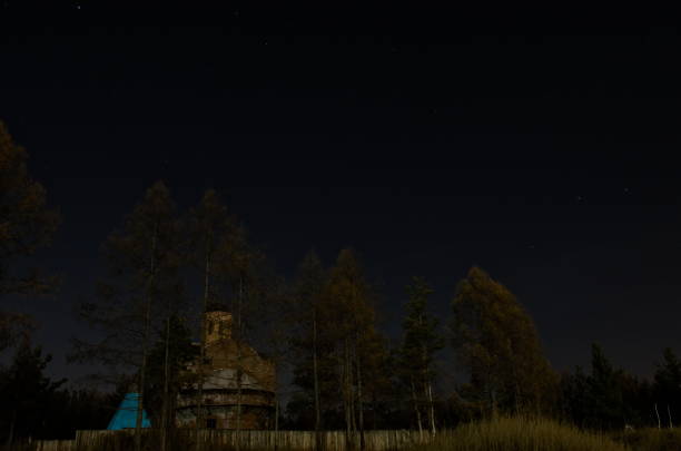 istock Enigmatic moon light in autumn night with bright stars 1351705145