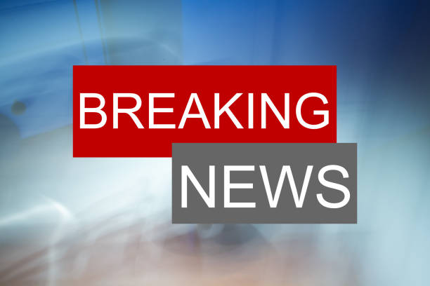 Symbol image: The words Breaking News on an abstract background stock photo