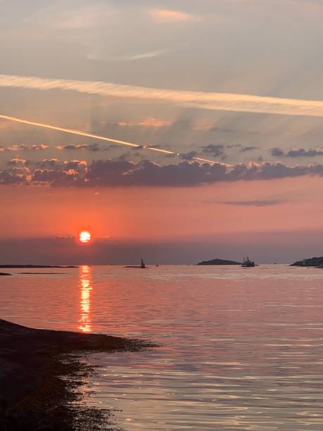 istock Sunset and a fishingboat 1351708431