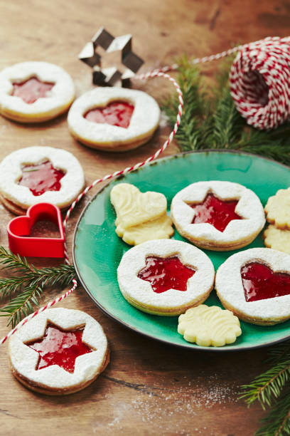 istock Classic Linzer Christmas Cookies with raspberry or strawberry jam on wooden table 1351710030