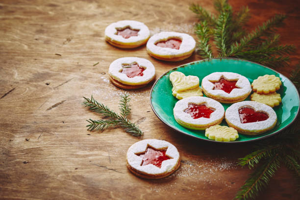 istock Classic Linzer Christmas Cookies with raspberry or strawberry jam on wooden table 1351710074