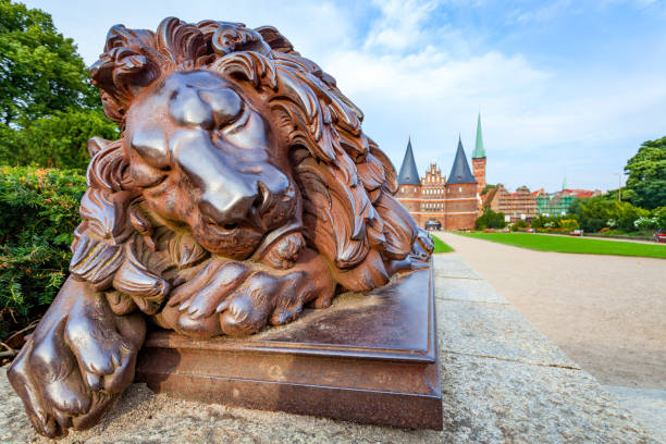 istock Statue Of Sleeping Lion in Lubeck 1351712760