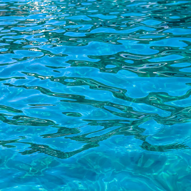 istock Turquoise sea in sunshine glow as surface background. Summer holidays concept 1351715733