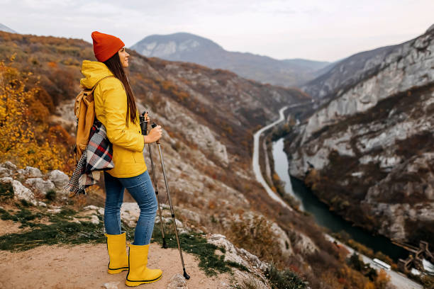 istock Explorer girl going up on hill. 1351716690