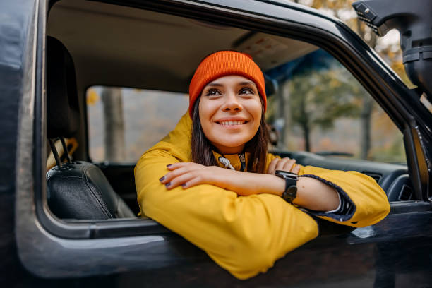 Woman on a road trip with car