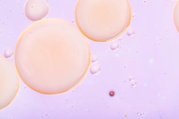 istock Oil drops in water on a colored background. Abstract pastel bubble background. Abstract fluid pattern. Close up 1351717608