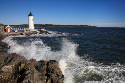 Lighthouse Amid Rough Surf On A Windy Morning At The The Portsmouth Harbor Light, New Castle, New Hampshire