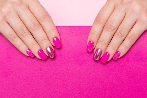 istock Female hand with festive manicure nails 1351725729