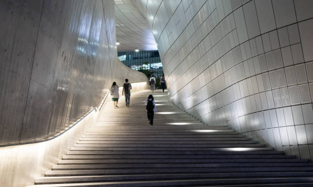 People Walking up Staircase Between Modern Museums and Galleries in Seoul stock photo
