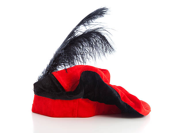 red with black hat of Zwarte Piet red with black hat of Zwarte Piet, typical Dutch event in december, isolated on white background zwarte piet stock pictures, royalty-free photos & images