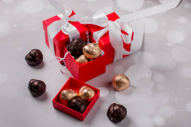 istock Red gift box and chocolates. holiday gift 1351742280