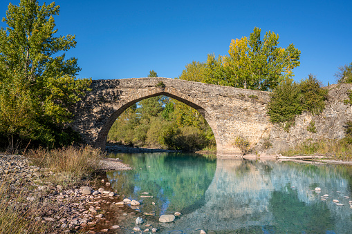 Tower Bridge in Echo at Valle de Hecho in Huesca Pyrenees over Aragon Subordan river