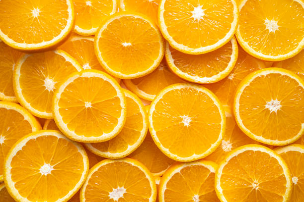 orange fruit slices citrus arrangement full frame background - breakfast close up studio shot group of objects imagens e fotografias de stock