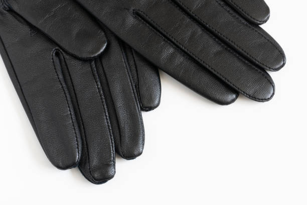istock Black leather gloves  on white background 1351751518