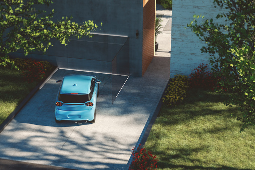 Modern house driveway with car. Generic vehicle is custom modeled and not based on any real or concept model/brand.