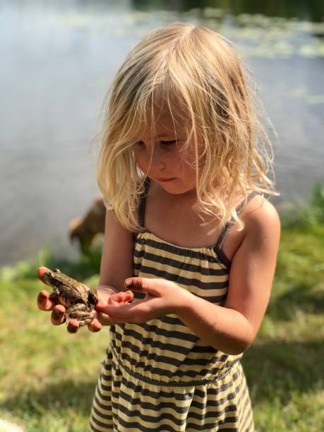 istock Girl with frog 1351751650