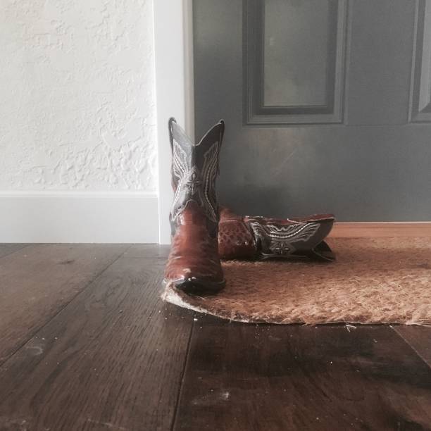 Cowboy boots by a blue door
