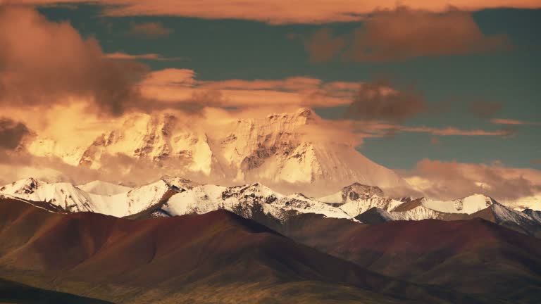 4k timelapse huge clouds mass rolling over lake namtso & snow mountain in tibet